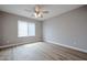 Bedroom featuring hard wood floors, a ceiling fan, and a window with blinds at 9346 E Citrus N Ln, Sun Lakes, AZ 85248