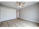 Bedroom featuring a large closet, a ceiling fan, and hard wood floors at 9346 E Citrus N Ln, Sun Lakes, AZ 85248