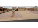 Charming single-story home featuring a desert landscape, concrete driveway, and attached two-car garage at 9346 E Citrus N Ln, Sun Lakes, AZ 85248