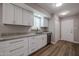 Bright kitchen with white cabinets, granite countertops, stainless steel appliances, and wood-look flooring at 9346 E Citrus N Ln, Sun Lakes, AZ 85248
