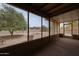 Screened in back patio featuring views of the backyard, desert landscaping, and trees at 9346 E Citrus N Ln, Sun Lakes, AZ 85248