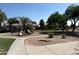 Community playground with playset and walking path at 11329 E Caballero St, Mesa, AZ 85207