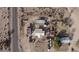 Aerial view of a home with several outbuildings and a large lot at 12601 S Hermit Rd, Buckeye, AZ 85326