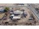 Aerial view showing a house and several outbuildings on a large lot at 12601 S Hermit Rd, Buckeye, AZ 85326