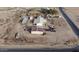 Aerial view of home and multiple outbuildings on a large lot at 12601 S Hermit Rd, Buckeye, AZ 85326