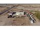 Aerial view of a house with large yard and outbuildings at 12601 S Hermit Rd, Buckeye, AZ 85326