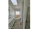 Bathroom with soaking tub, skylight and tile floors at 12601 S Hermit Rd, Buckeye, AZ 85326