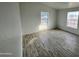 Bedroom with wood-look floors and large windows at 12601 S Hermit Rd, Buckeye, AZ 85326