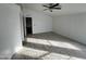 Spacious bedroom with wood-look floors and ceiling fan at 12601 S Hermit Rd, Buckeye, AZ 85326