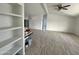 Open living room with wood-look floors and built-in shelves at 12601 S Hermit Rd, Buckeye, AZ 85326