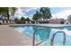 Community pool with lounge chairs and surrounding landscaping at 18803 N 33Rd Dr, Phoenix, AZ 85027