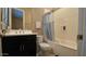 Bathroom with shower/tub combo and dark vanity at 2285 E Mead Dr, Gilbert, AZ 85298