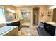 Luxurious bathroom with double sinks, soaking tub, and large shower at 2285 E Mead Dr, Gilbert, AZ 85298