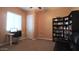 Home office features built-in shelving and a workspace at 2285 E Mead Dr, Gilbert, AZ 85298