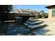 Stone hot tub with steps and a built in bar at 2285 E Mead Dr, Gilbert, AZ 85298