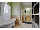 Elegant bathroom with a clawfoot tub, pedestal sinks, and designer fixtures at 6411 S River Dr # 26, Tempe, AZ 85283