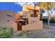 Charming exterior with a balcony, private entrance, and stucco architecture in a desert landscape at 6411 S River Dr # 26, Tempe, AZ 85283