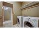 Bright laundry room featuring tile floors and modern washer and dryer at 6411 S River Dr # 26, Tempe, AZ 85283