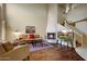 Living room with hardwood floors, fireplace, and spiral staircase at 6411 S River Dr # 26, Tempe, AZ 85283