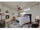 Cozy main bedroom featuring a fireplace, wood floors, and a decorative rug at 6411 S River Dr # 26, Tempe, AZ 85283