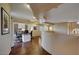 Spacious office area with custom built-ins, unique ceiling design, and hardwood floors at 6411 S River Dr # 26, Tempe, AZ 85283