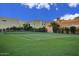 Community tennis court surrounded by mature landscaping at 6411 S River Dr # 26, Tempe, AZ 85283