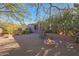 Landscaped backyard with fire pit and partial house view at 6486 E Oberlin Way, Scottsdale, AZ 85266