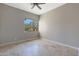 Simple bedroom with tile floors and ceiling fan at 6486 E Oberlin Way, Scottsdale, AZ 85266