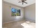 Bright bedroom with tile floors and a large window at 6486 E Oberlin Way, Scottsdale, AZ 85266