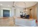 Formal dining room with a chandelier and adjacent kitchen at 6486 E Oberlin Way, Scottsdale, AZ 85266