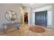 Elegant entryway with tile flooring and a built-in library at 6486 E Oberlin Way, Scottsdale, AZ 85266