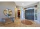 Elegant entryway with tile flooring and a built-in library at 6486 E Oberlin Way, Scottsdale, AZ 85266