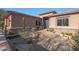 Lovely desert landscaping surrounds this home's entrance at 6486 E Oberlin Way, Scottsdale, AZ 85266