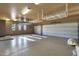 Spacious garage with overhead storage and built-in cabinets at 6486 E Oberlin Way, Scottsdale, AZ 85266