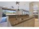 Kitchen wet bar with granite countertop and sink at 6486 E Oberlin Way, Scottsdale, AZ 85266