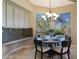 Kitchen breakfast nook with table and chairs, and large windows at 6486 E Oberlin Way, Scottsdale, AZ 85266