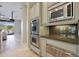 Modern kitchen features double ovens and built-in microwave at 6486 E Oberlin Way, Scottsdale, AZ 85266