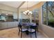 Bright eat-in kitchen area with bay window and chandelier at 6486 E Oberlin Way, Scottsdale, AZ 85266