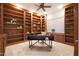 Home library with built-in bookshelves and a workspace at 6486 E Oberlin Way, Scottsdale, AZ 85266