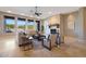 Spacious living room with stone fireplace and large windows at 6486 E Oberlin Way, Scottsdale, AZ 85266