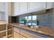 Wet bar with granite countertop and sink at 6486 E Oberlin Way, Scottsdale, AZ 85266