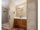 Bathroom with wood vanity, large mirror, and walk-in shower at 16246 N 32Nd Way, Phoenix, AZ 85032