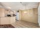 Kitchen with light wood cabinets, ample counter space, and a breakfast bar at 16246 N 32Nd Way, Phoenix, AZ 85032