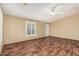 Bright and airy living room with wood-look floors and large windows with shutters at 16246 N 32Nd Way, Phoenix, AZ 85032