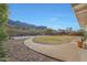 Spacious backyard with mountain views and a paved pathway at 2343 E Orangewood Ave, Phoenix, AZ 85020