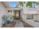 Inviting entryway with a glass door, and landscaped pathway at 2343 E Orangewood Ave, Phoenix, AZ 85020