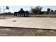 Community basketball court featuring a covered structure, basketball hoops, and play area at 3120 N 67Th Ln # 47, Phoenix, AZ 85033