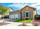 Two-story home with stone accents, landscaping, and a two-car garage at 2005 W Trotter Trl, Phoenix, AZ 85085