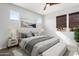 Airy bedroom features soft lighting, a modern bed, and calming decor, creating a peaceful retreat at 4779 N 205Th Gln, Buckeye, AZ 85396