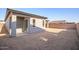 Landscaped backyard with covered patio and new construction home at 20105 W Campbell Ave, Buckeye, AZ 85396